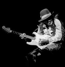 Jimi Hendrix playing his guitar