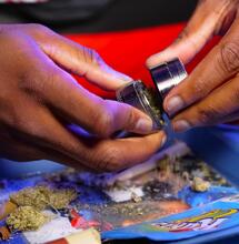 man emptying grinder