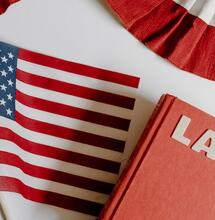 US Law book and flag