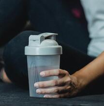 man holding water bottle
