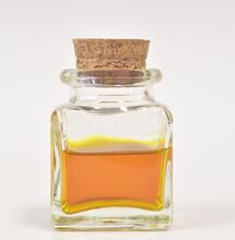 a bottle with yellow-colored cannabis tincture, this article explains how to make your own cannabis tincture at home