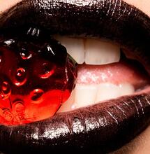 woman lipsticks with fruit. 