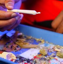 man rolling up on a tray