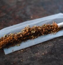 tobacco roll with rolling paper.