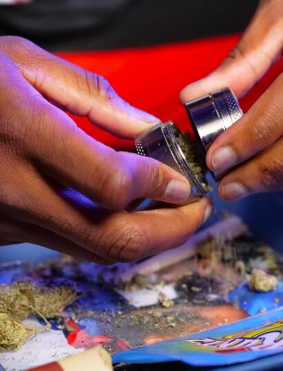 man emptying grinder