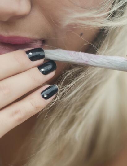 woman licking a joint. 