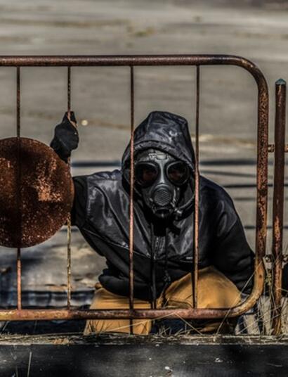 man at Chernobyl site wearing gas mask