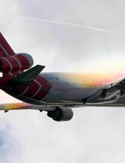 a plane taken off and flying in the sky and the clouds