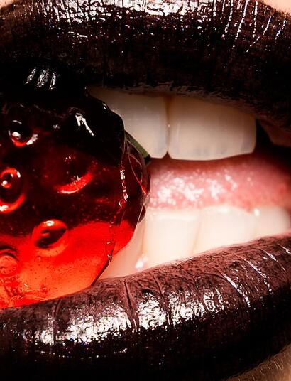 woman lipsticks with fruit. 