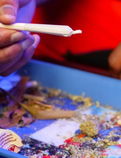 man rolling up on a tray