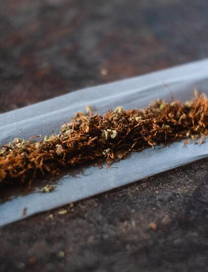 tobacco roll with rolling paper.