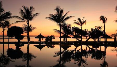 sunset beach view in Indonesia, the country where basketball player Jarred Shaw was arrested for possession of cannabis edibles