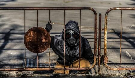 man at Chernobyl site wearing gas mask
