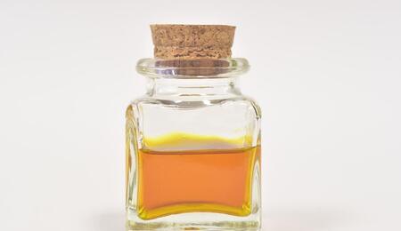 a bottle with yellow-colored cannabis tincture, this article explains how to make your own cannabis tincture at home
