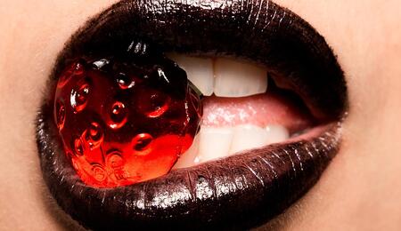 woman lipsticks with fruit. 