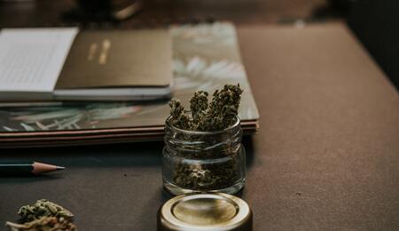 Jar of weed on a desk