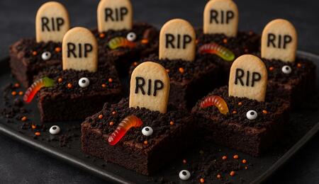 Bake a spooky Halloween cannabis brownie with fudgy chocolate, Oreo “grave dirt,” and gummy worms — perfectly dosed pot edible for a chilling festive treat.