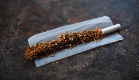 tobacco roll with rolling paper.