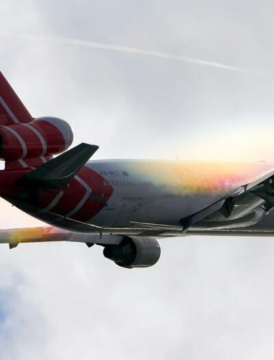 a plane taken off and flying in the sky and the clouds