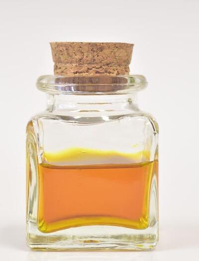 a bottle with yellow-colored cannabis tincture, this article explains how to make your own cannabis tincture at home