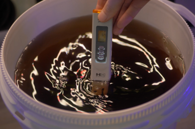 Measuring pH levels of nutrient water mix